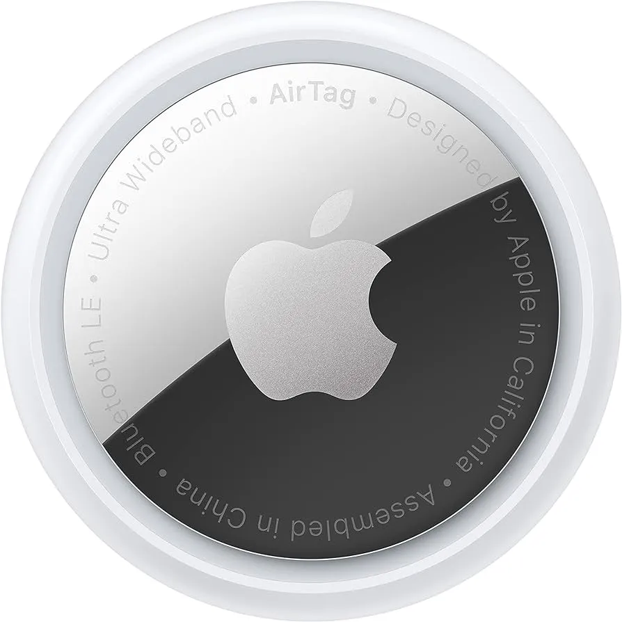 Apple AirTag with white plastic casing and black and silver circular tracking device face