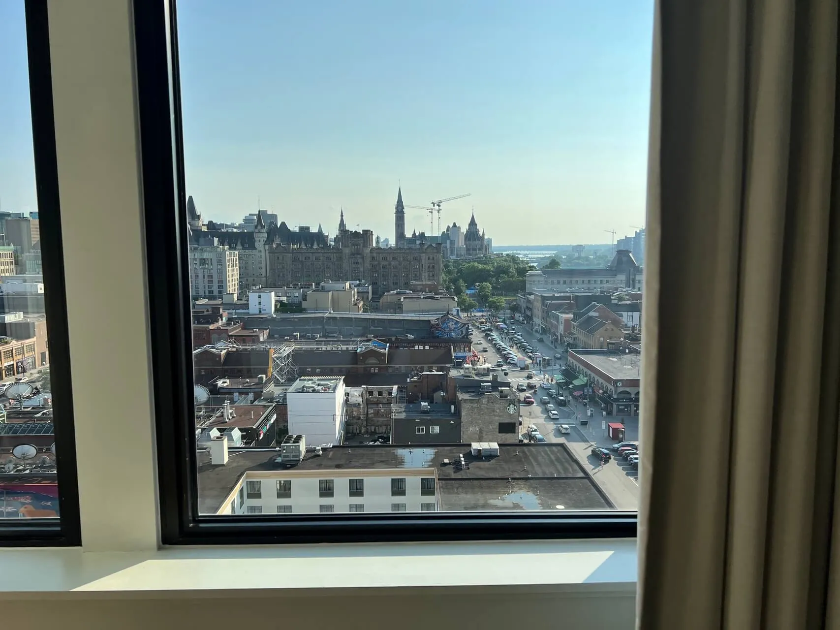 Parliament Hill and Ottawa skyline view from high-rise hotel window