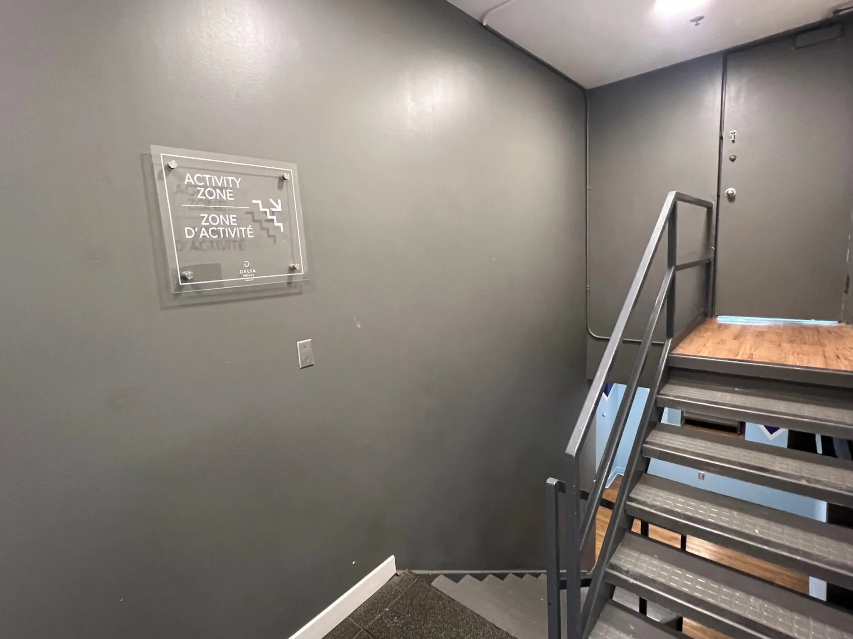 Stairwell with Activity Zone bilingual sign at Delta Hotels Ottawa