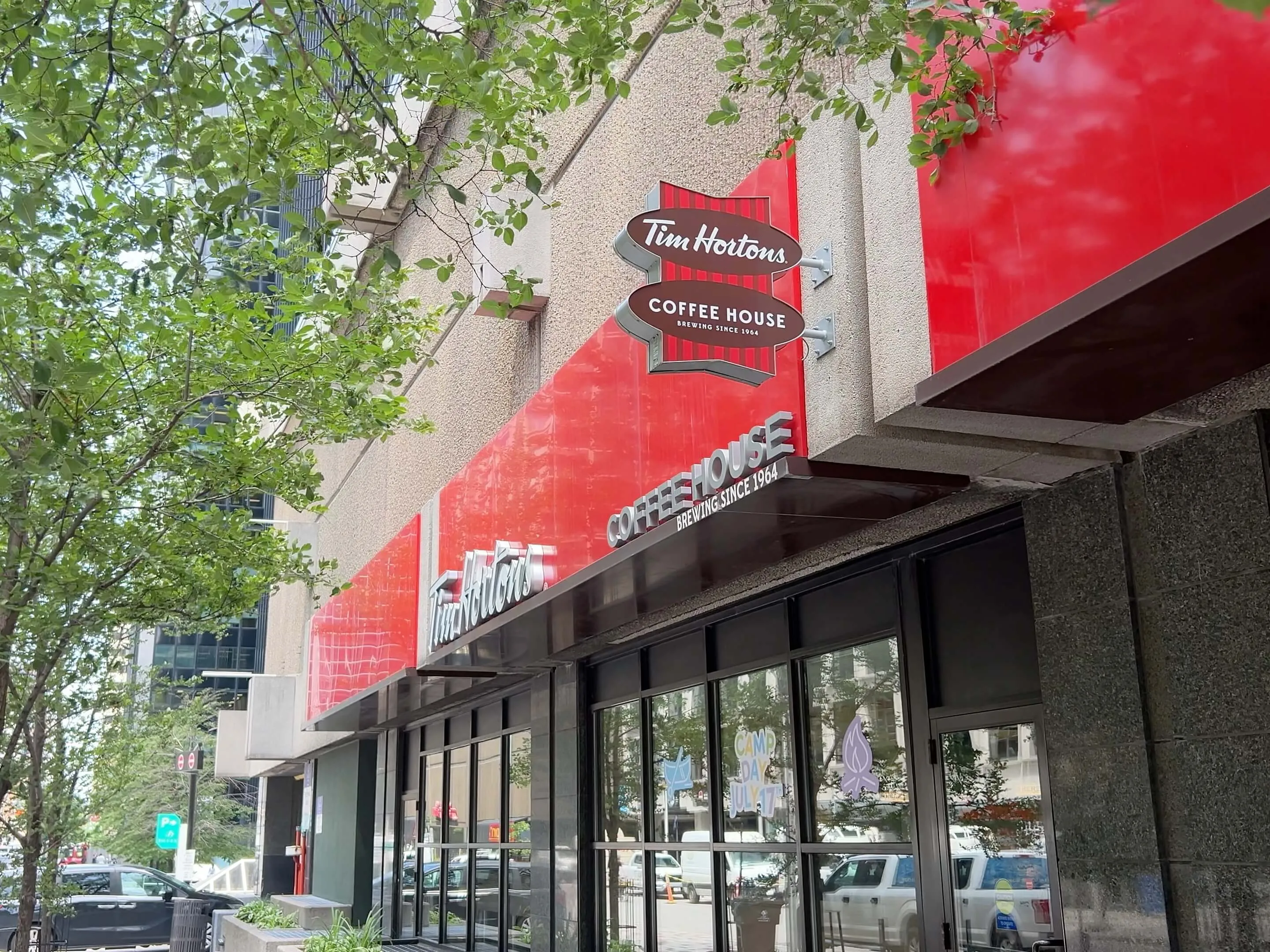 Tim Hortons Coffee House storefront with red signage on urban street corner