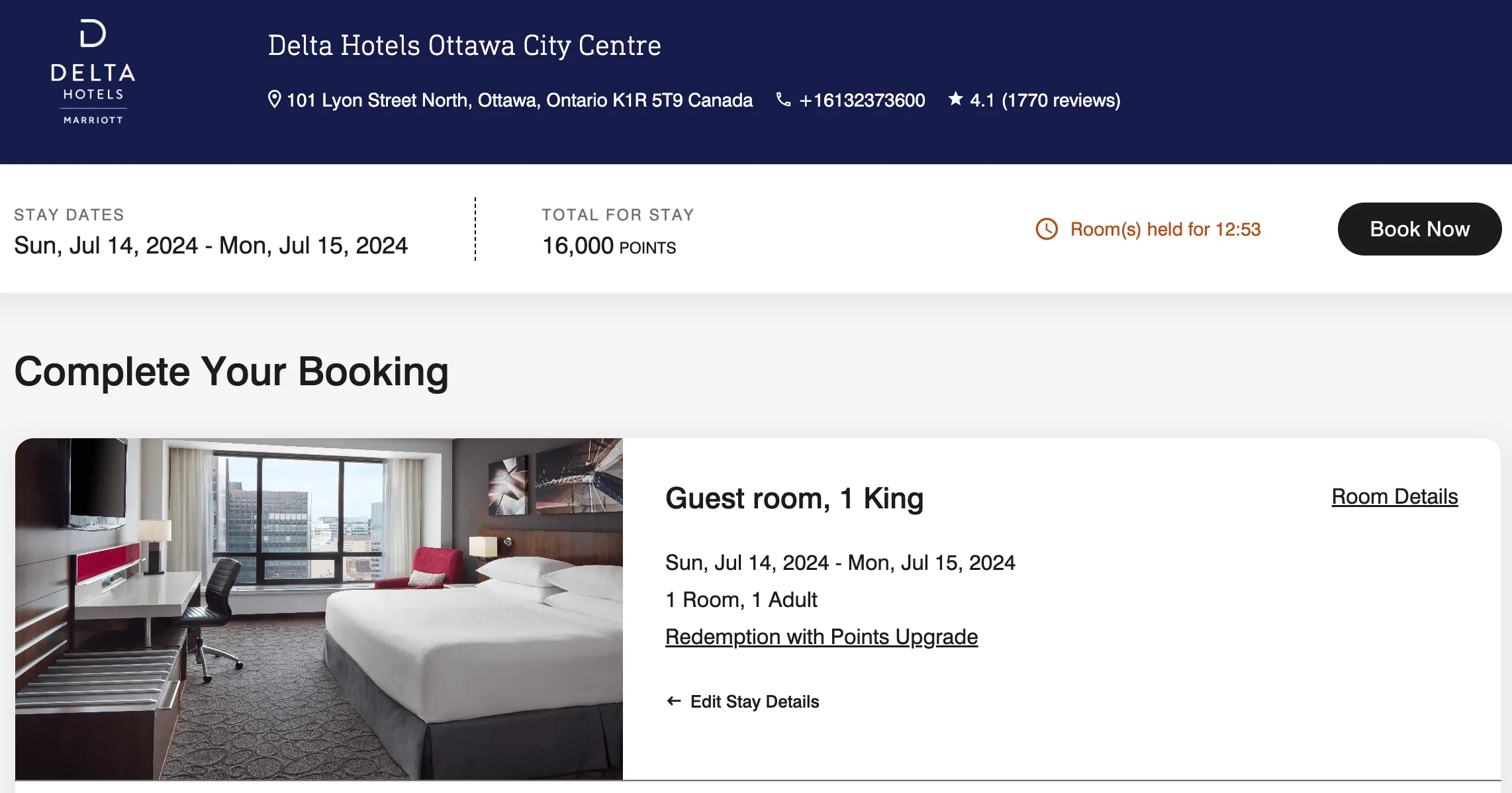 King bed guest room at Delta Hotels Ottawa City Centre with floor-to-ceiling windows and city view