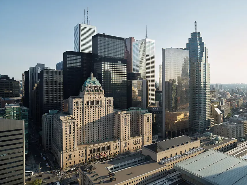 Toronto skyline featuring the Fairmont Royal York hotel and downtown financial district towers at golden hour