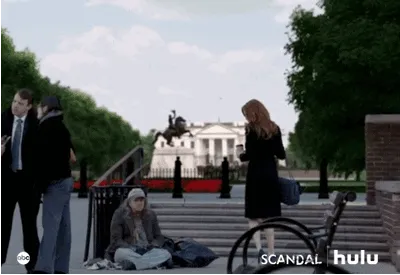 White House view from Pennsylvania Avenue with pedestrians and security barrier