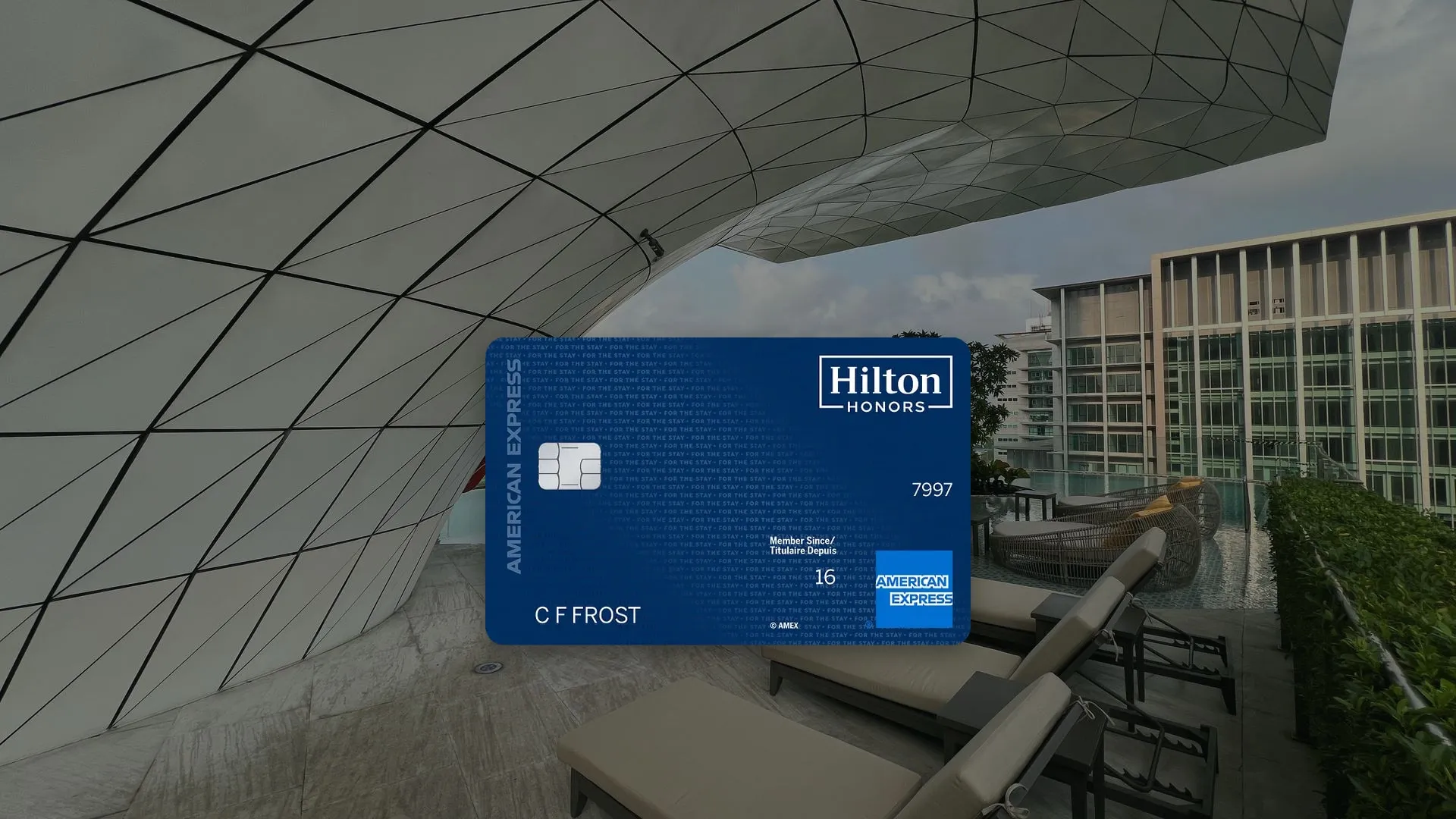 The Hilton Honors American Express® Card over the rooftop pool at Waldorf Astoria Bangkok