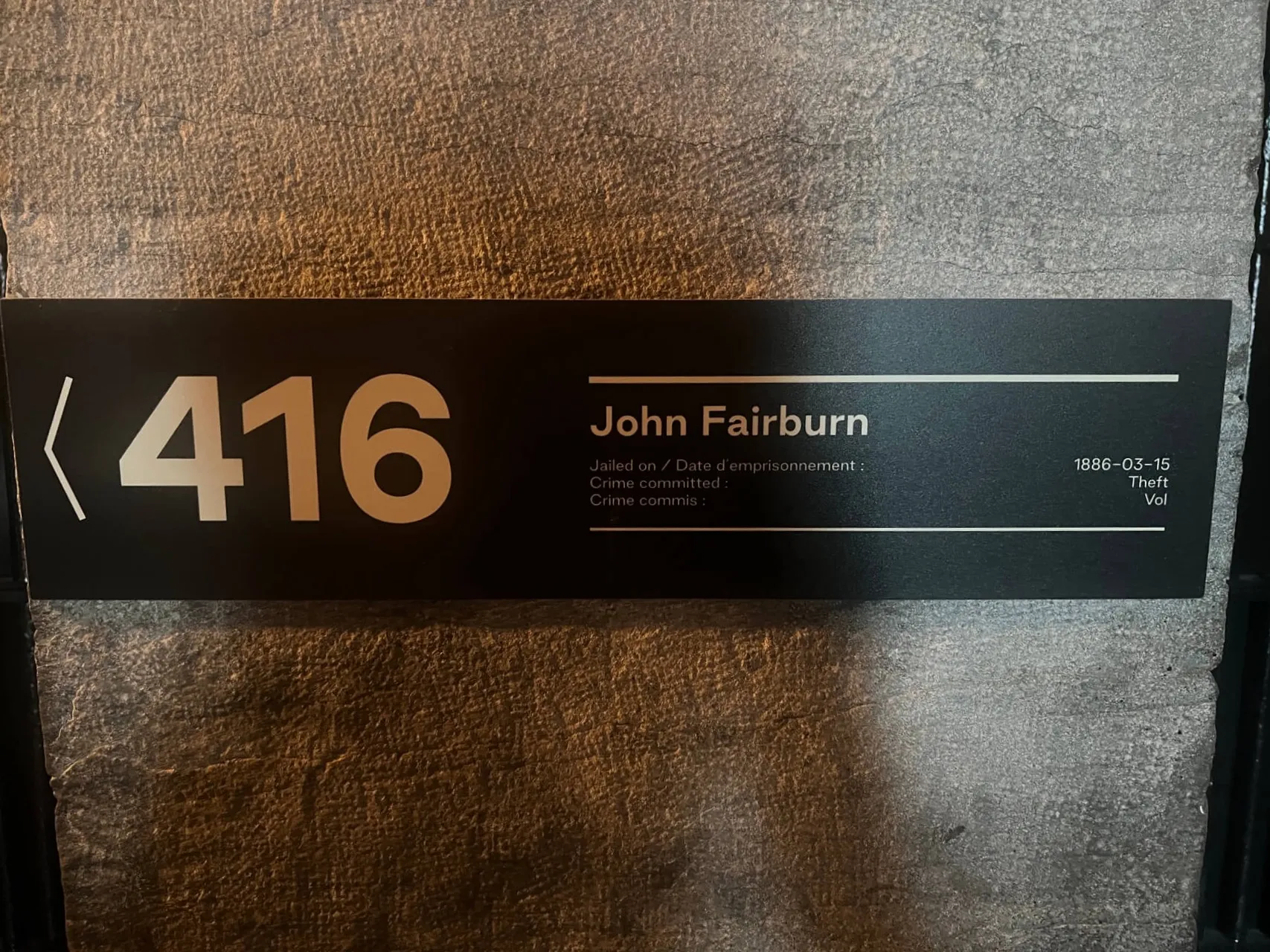 Hotel room number 416 plaque with John Fairburn name and date 1986-03-15