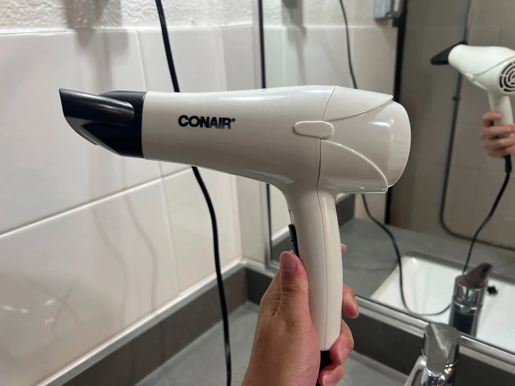 Conair hair dryer in hotel bathroom at Saint-Louis Ottawa