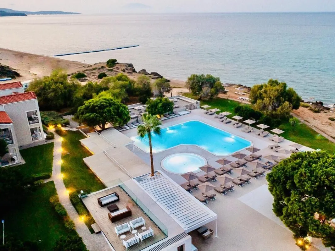 Beachfront pool and lounge area at The Bay Hotel & Suites on Zante, overlooking Ionian Sea