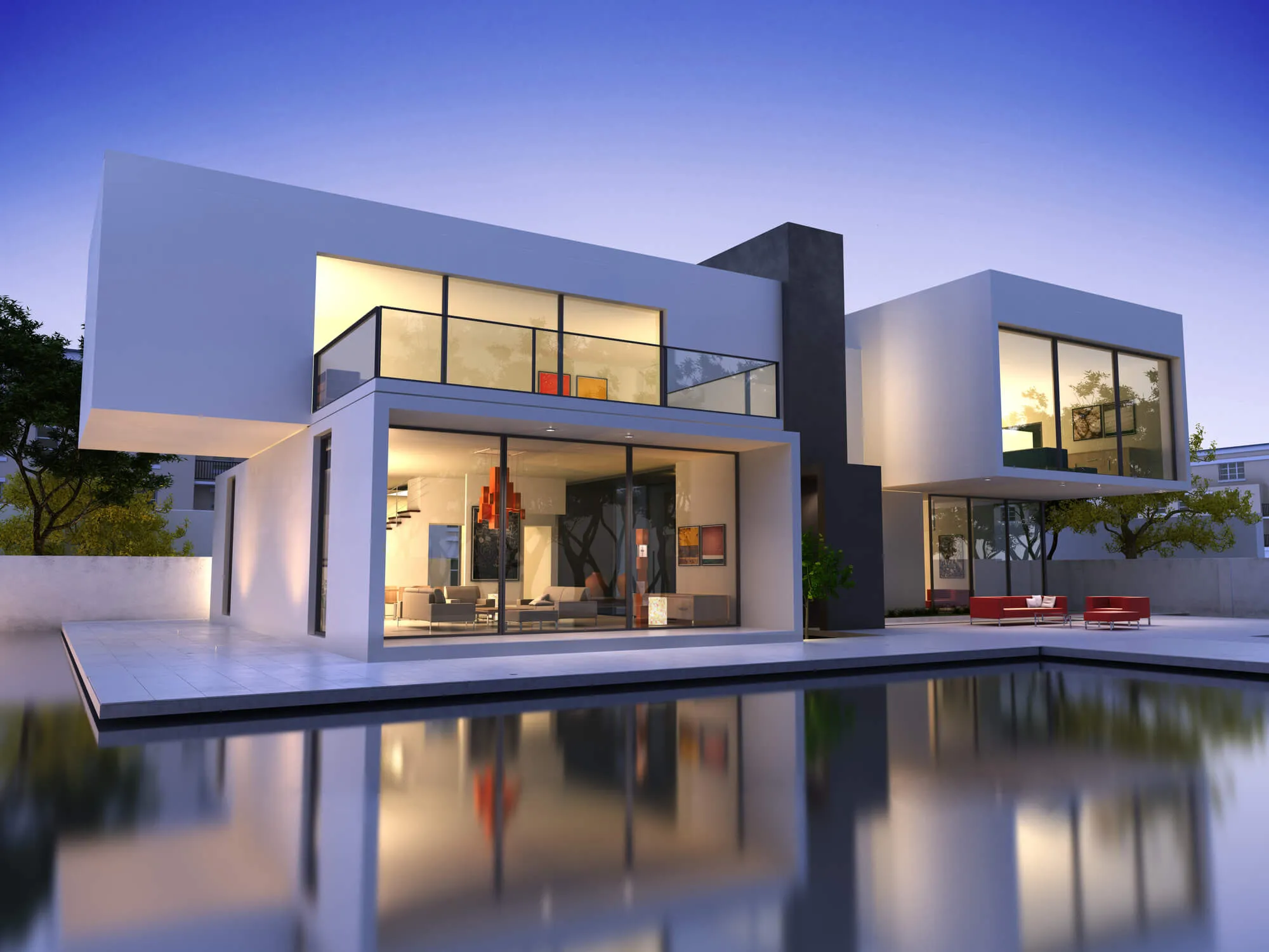 Modern minimalist vacation home with white and black facade, floor-to-ceiling glass walls, reflecting pool at dusk.